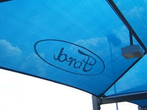 Blue commercial shade structure with Ford logo