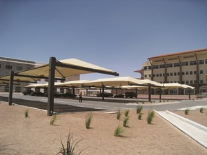 Shade structures in desert protecting cars from UV