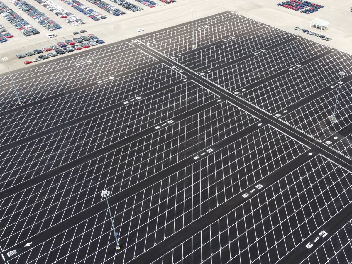 holding lot for vehicles, freshly painted striping
