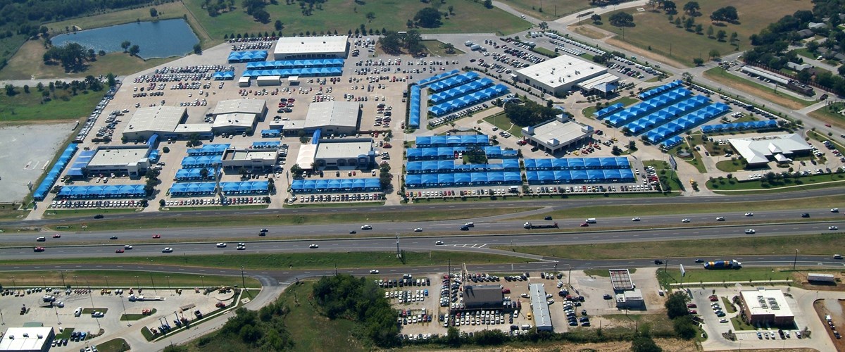 Massive blue-topped parking structure view from above