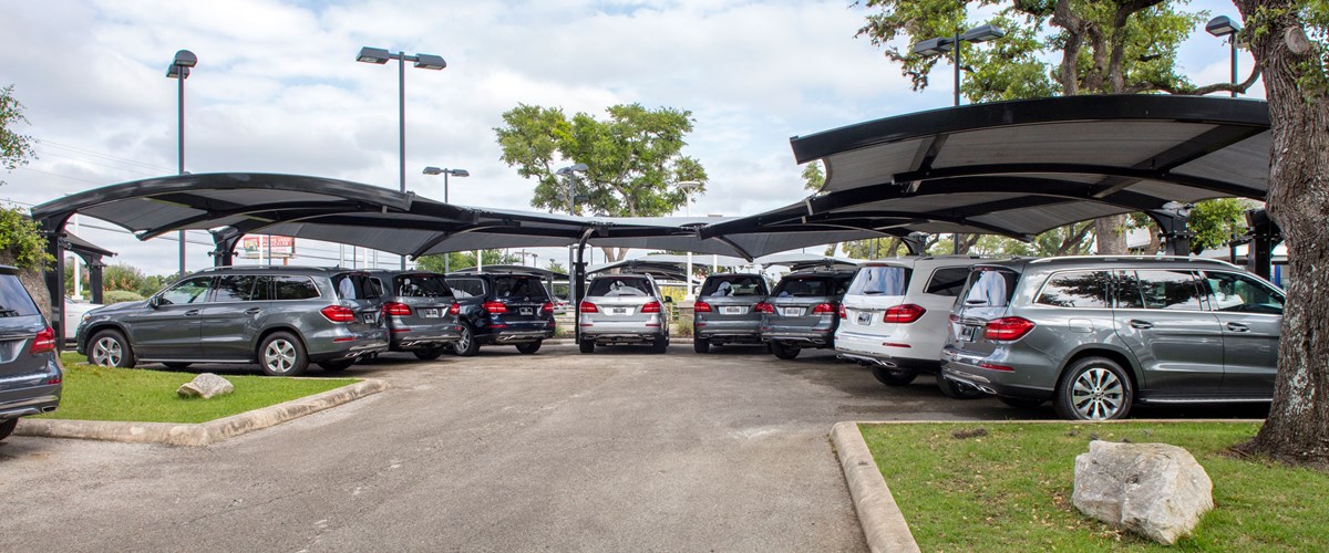 Rear view of cars parking under structure thumbnail