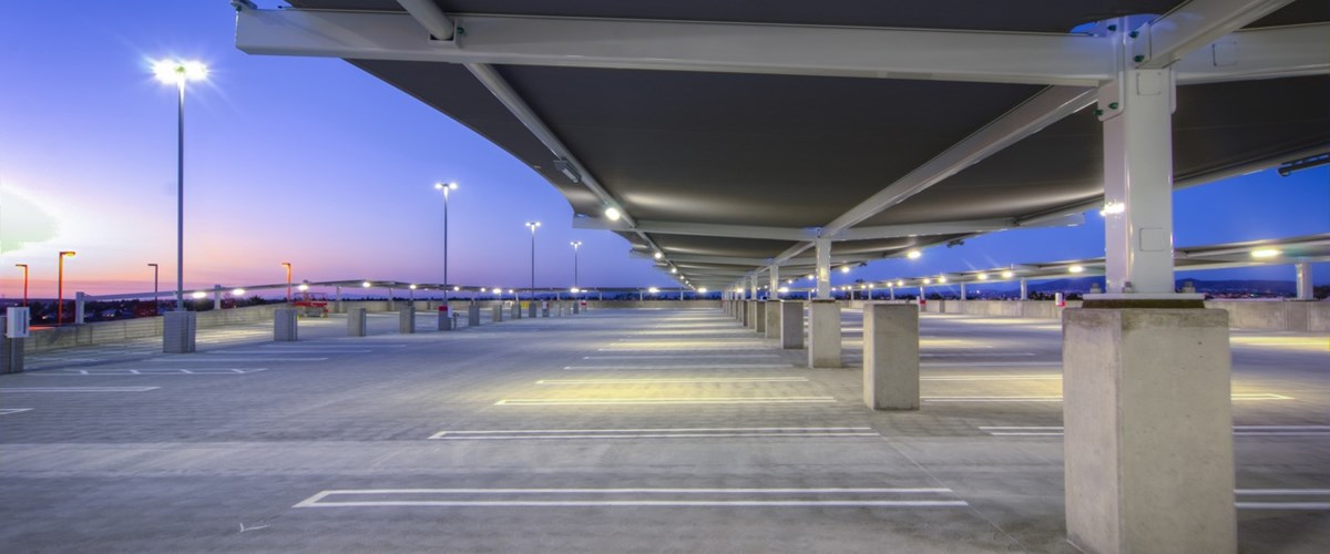 covered parking lot at night time thumbnail
