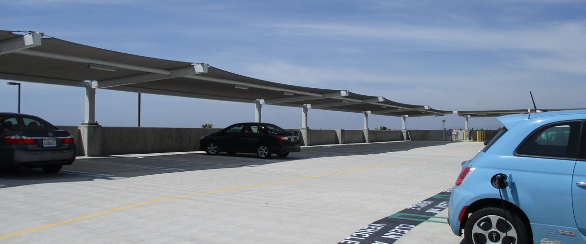 vehicles covered by shade structure on rooftop thumbnail