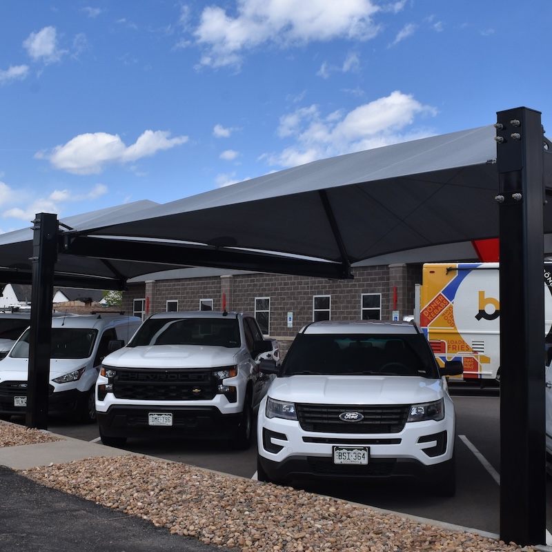 emergency vehicles covered by protective shade structure