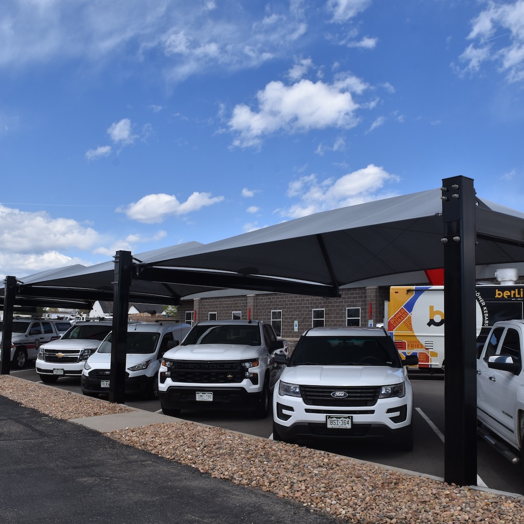 emergency vehicles covered by protective shade structure