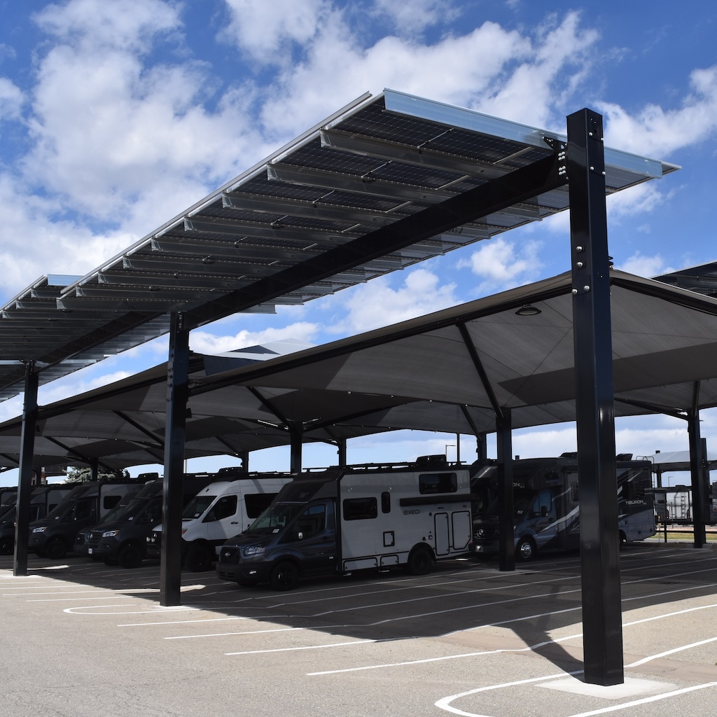 RV motor homes covered by protective shade structure