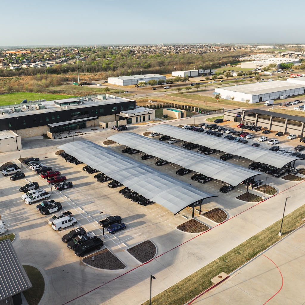 Mansfield Police Department, aerial view of parking lot with protective structures for vehicles thumbnail