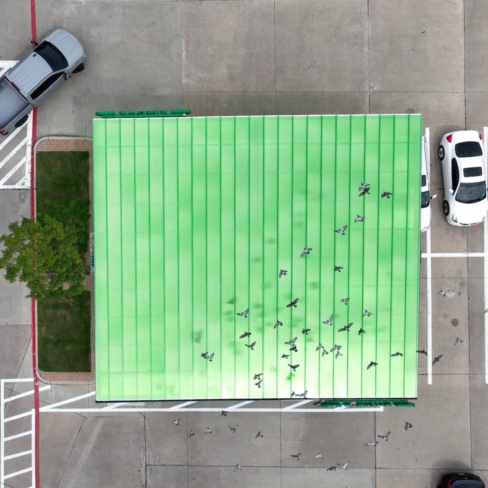 aerial view of curbside pickup covered by protective roof thumbnail