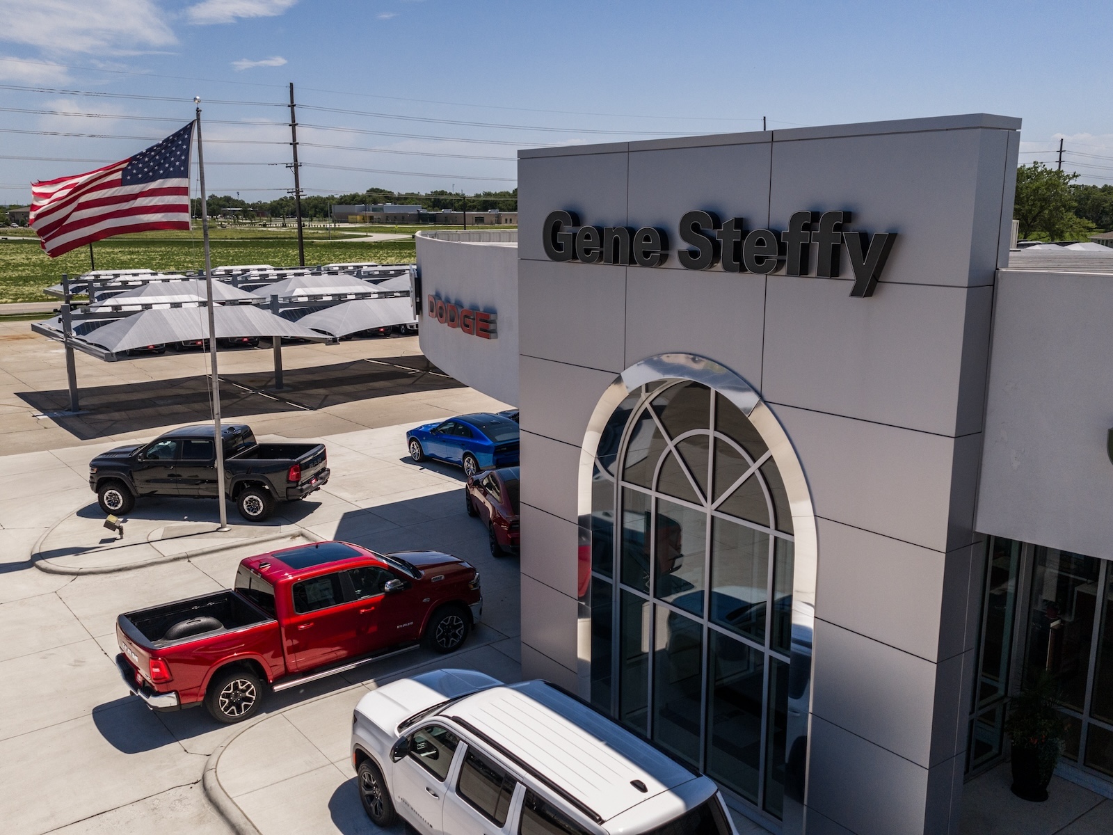 aerial view, front of building, Gene Steffy automobile dealership, signage
