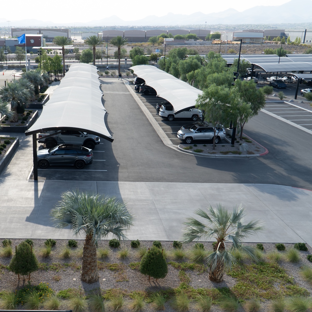 covered parking structure for the Intermountain Healthcare Performance Center in Nevada, cars parked in the shade, aerial view thumbnail